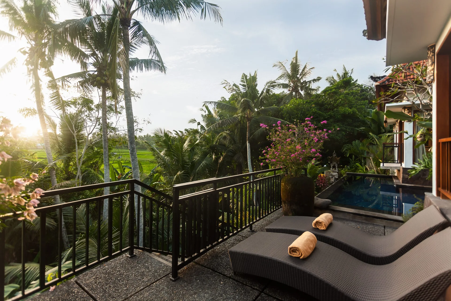 Balcony with a reclining lounger and rolled towel above palms and rice fields, 2-Bedroom Tranquility Villa at The Shea Ubud